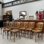 Suite de 14 chaises de bistrot Baumann pour « Henri Julien SA »
